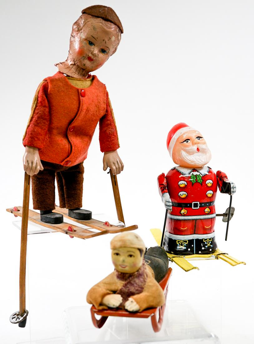Pull-Toys (2) and Wind-Up Santa (1): Collection of three 'Winter Sport' toys. Two pull toys and one wind-up. Tested. Measure 3.25 in. - 8 in. tall. If lot is absent of a condition report one may be requested via email. Condition report i