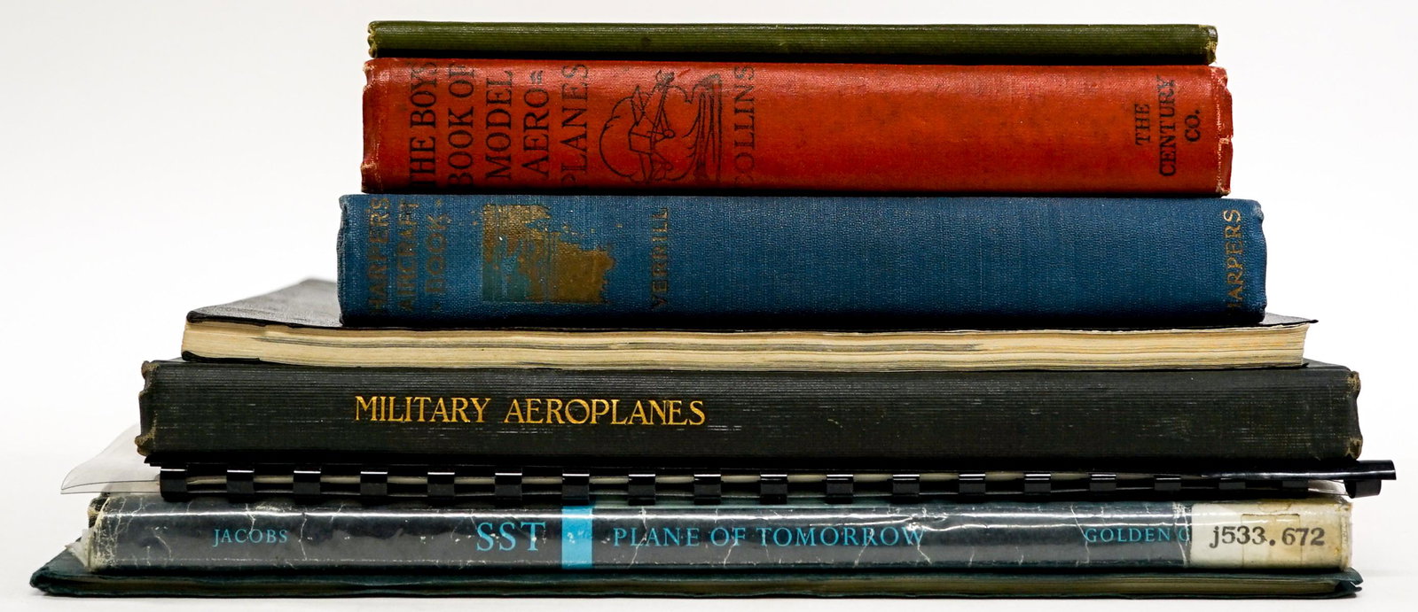 Aviation (8) Books and Ephemera: Collection of eight books of aviation and ephemera. Includes: 1) Set of three glossy photos of float plane. 2) The Boy's Book of Model Aeroplanes by Collins. 1910. ... and more. Group measures 11 in. 