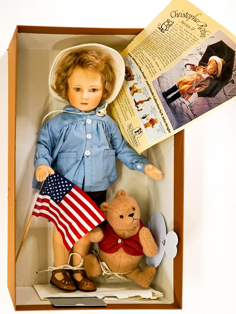 Christopher Robin and Winnie The Pooh MIB #311: R. John Wright; Christopher Robin and Winnie the Pooh dolls. Mint-in-Box. With certificate numbered 311 of 1000. Measure 20 in. and 8 in. tall. Box measures 20.25 in. x 12.25 in. x 6 in. tall. If lot