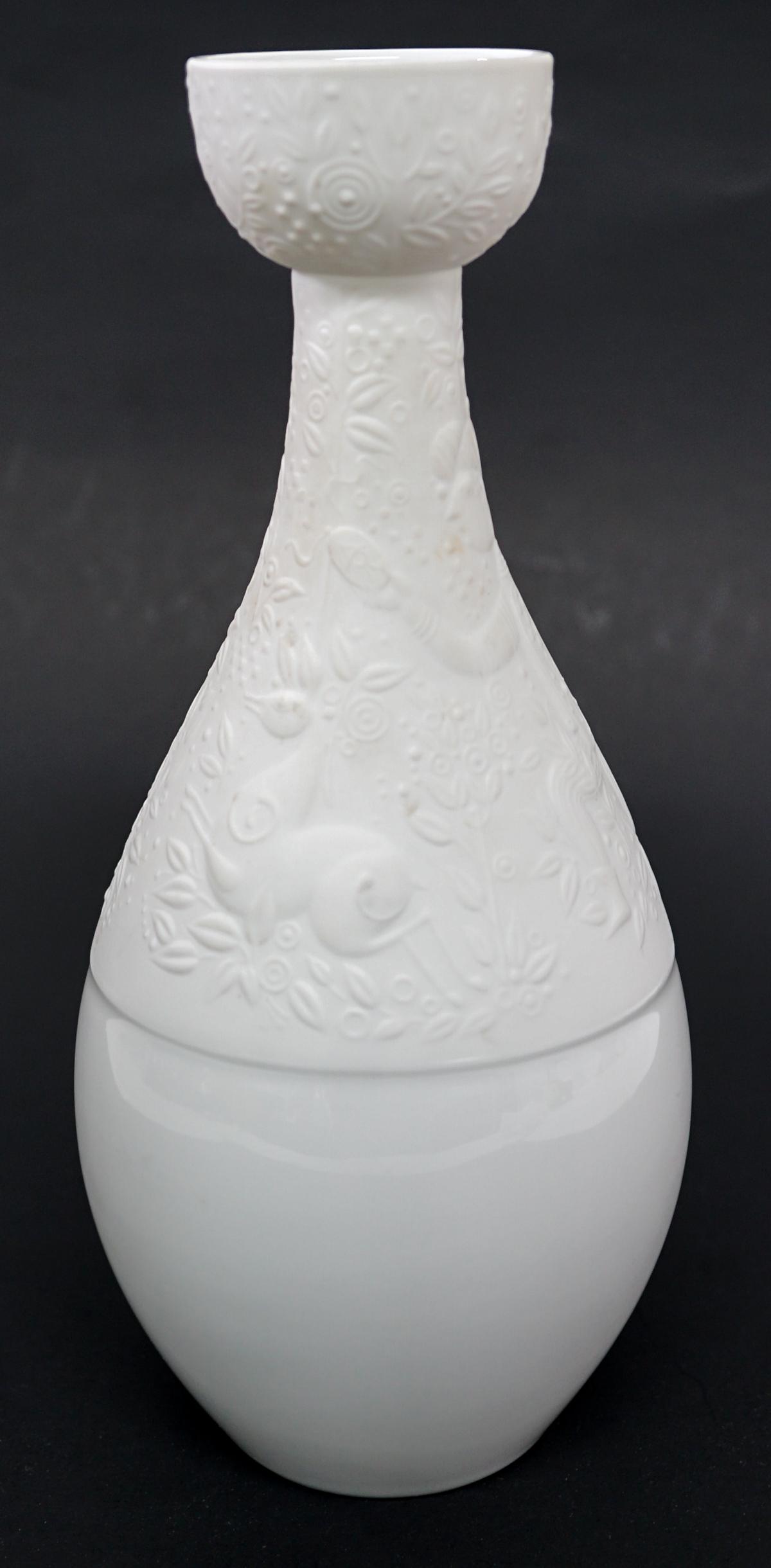 Rosenthal Germany Porcelain Bud Vase [Wiinblad]: Rosenthal Germany Studio-Line porcelain bud vase. Designed by Bjorn Wiinblad. White with matt finish design to the top half, the lower half is smooth. Measures 8.75 in. tall x 4 in. wide. Weighs 14 oz