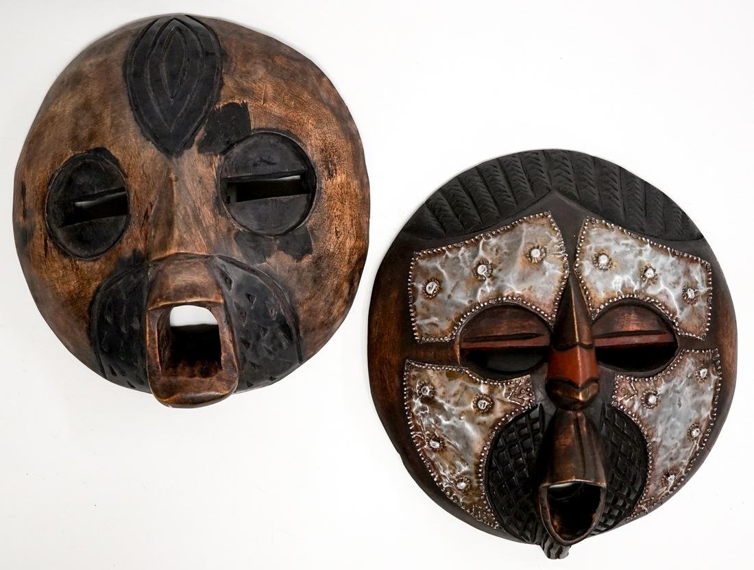 African (2) Ghana Wood Carved Masks: Two African Ghana wood carved masks. One is with wood accents. Measure 10 in. x 9.25 in. x 3.25 in. deep. Weigh 2 lbs 3 oz. If lot is absent of a condition report one may be requested via email. Condi