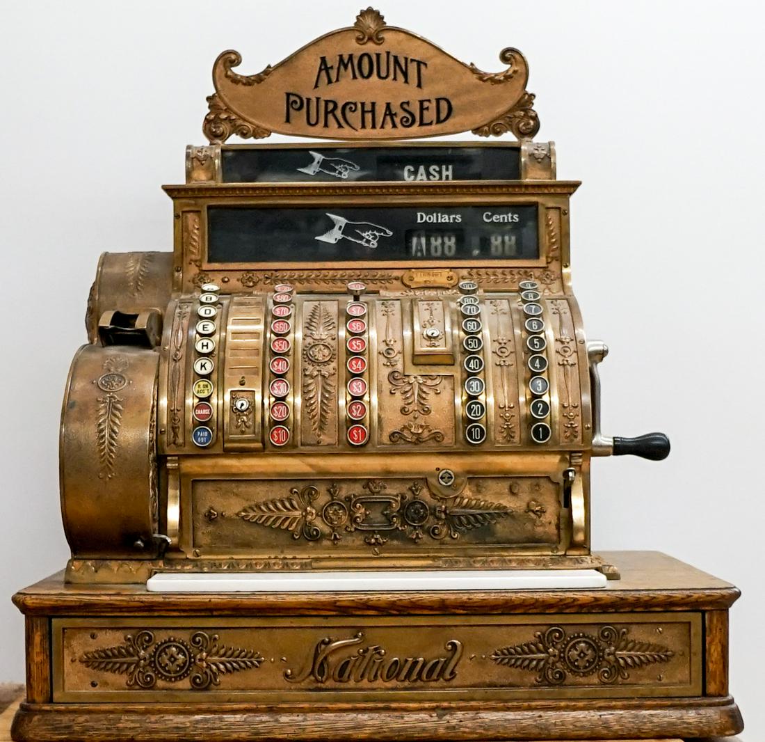 Antique National Cash Register: An antique National cash register. No keys, sold as-is, where-is. Measures 29 in. tall x 25 in. x 16.5 in. Weighs approximately 50 lbs. Outside shipper or buyer pick-up required. If lot is absent of a