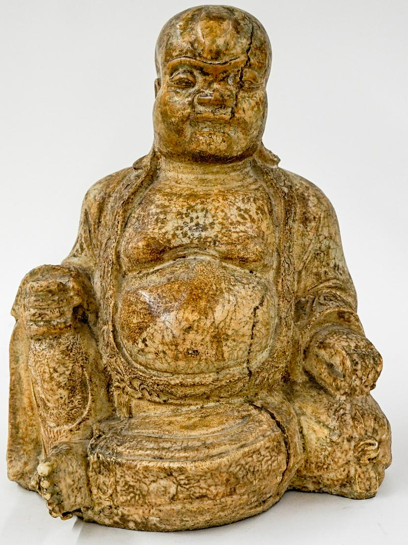 Wax Buddha Figure: A vintage heavy wax Buddha figure. Measures 12.5 in. x 9.25 in. x 6.75 in. If lot is absent of a condition report one may be requested via email. Condition report is provided as an opinion only and is