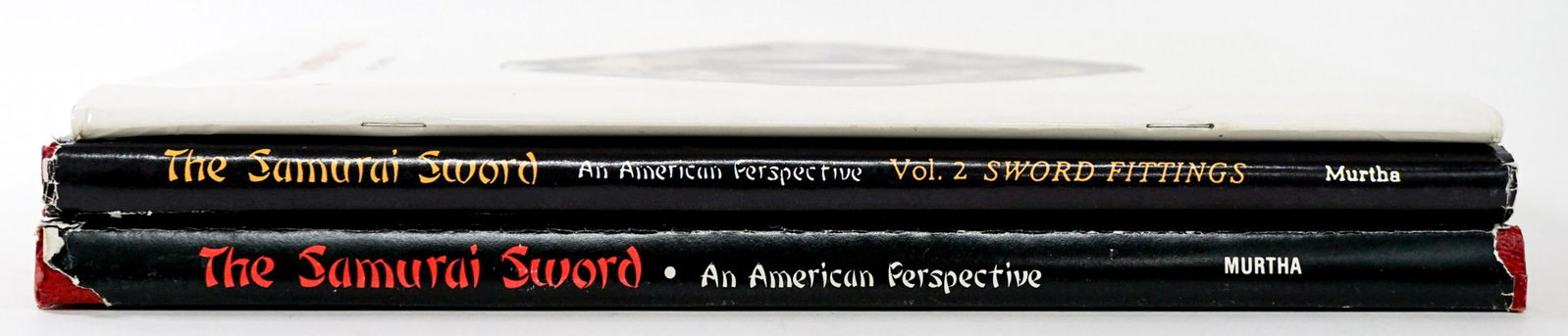 Samurai Sword Vol I and Vol II with ALS: The Samurai Sword, An American Perspective by Gary D. Murtha. Volumes I and II both with unclipped dust jackets. Accompanied with an ALS. 1980 and 1984. Lower corners of volume II are bumped. Set meas