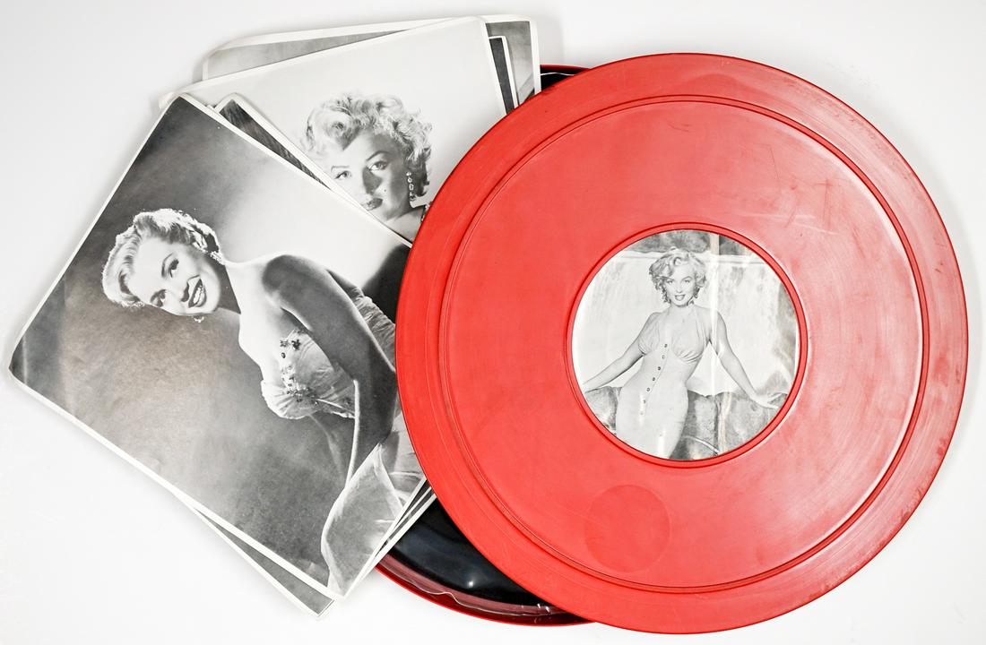 Marilyn Monroe Film Canister LP W/9 Photos: Film Canister LP with nine photos only. Bent at corners. Does not contain other items. Appear slightly or never played. Provenance: William Emery Collection, Sheridan Wyoming. If lot is absent of a co