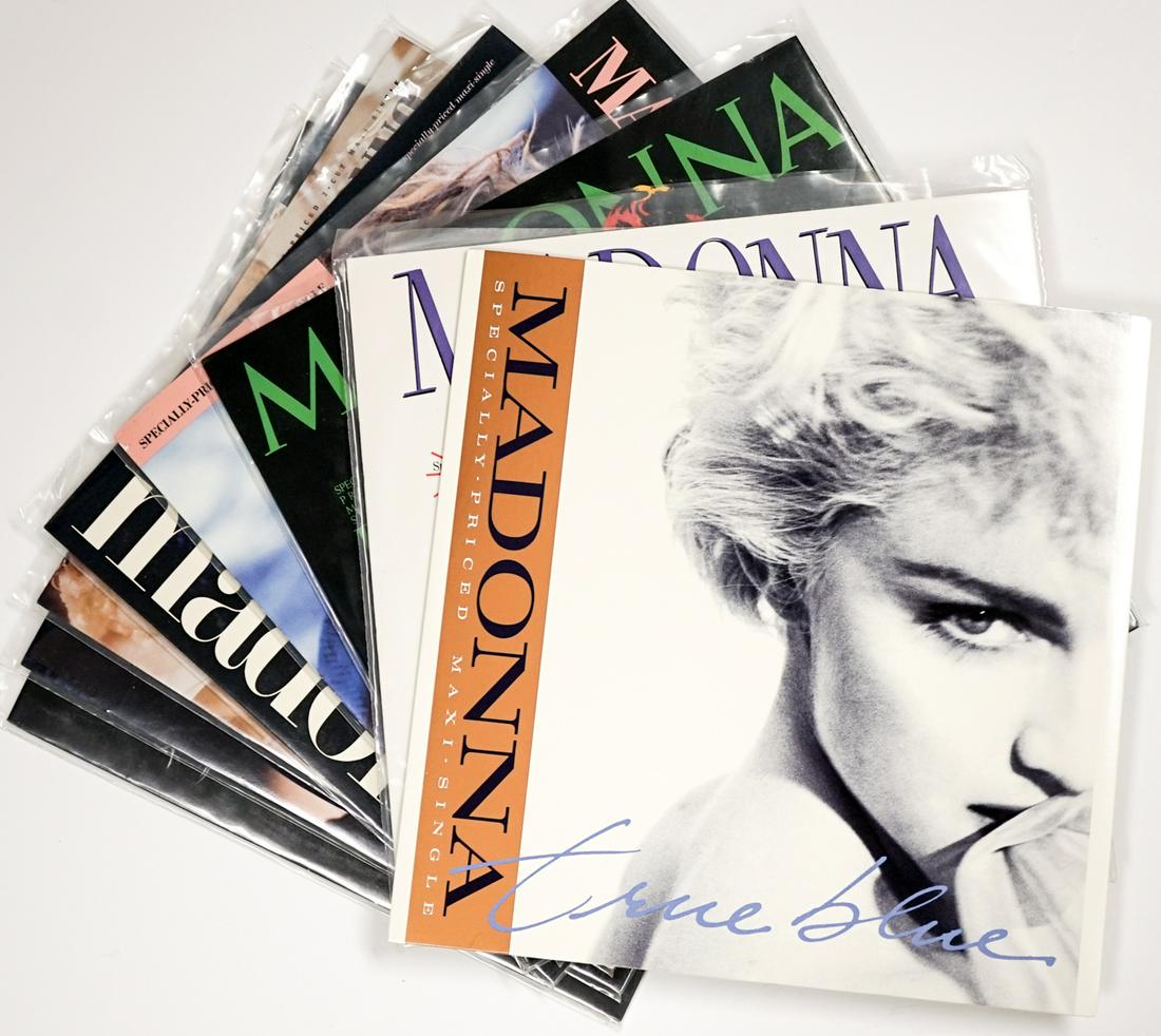 Madonna (8) Maxi-Singles 12 INCH (Vinyl): Eight (8) Madonna maxi-single 12 inch vinyl records. Sire Records. Includes: 1) True Blue. 9 30533 0 A. 2) Papa Don't Preach. 9 20492 0 A. 3) Borderline. 9 20212 0 A. 4) Material Girl. 9 20304 0 A. 5)