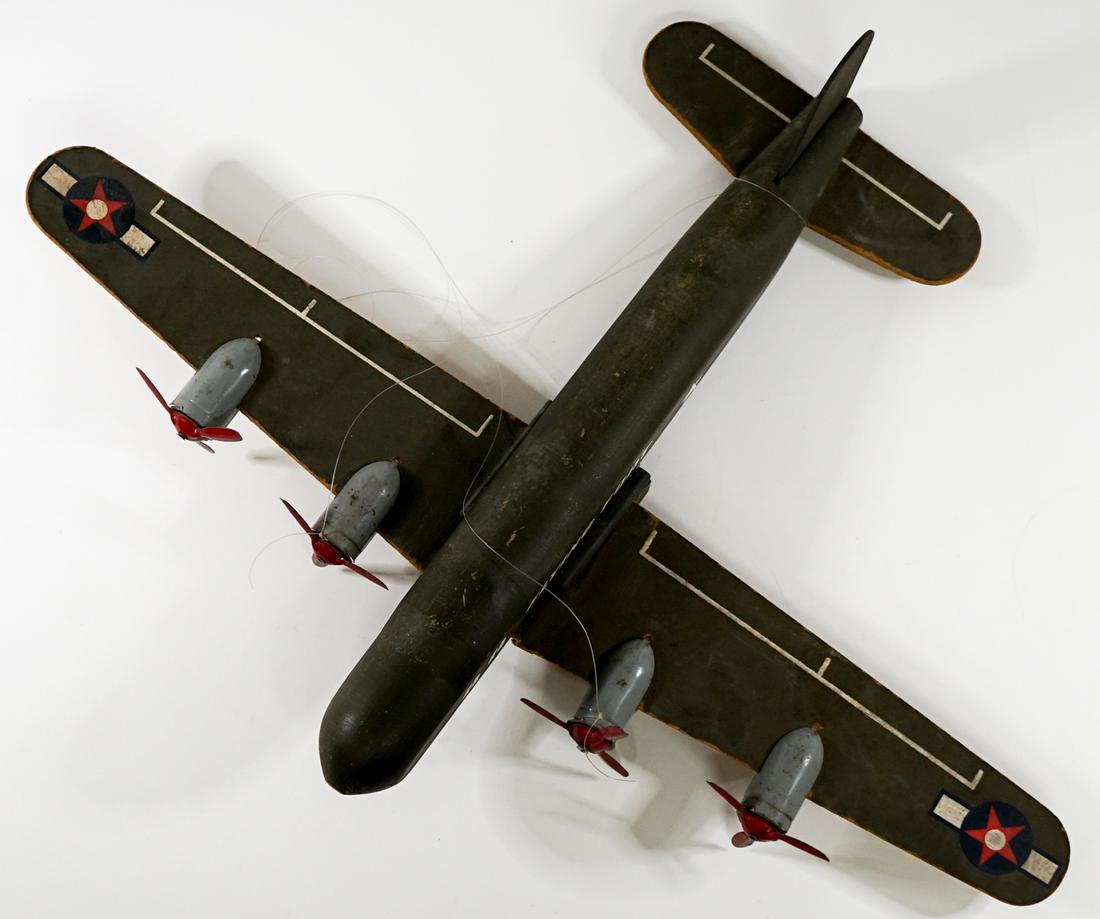 Flying Fort Wood and Metal Toy Plane: Flying Fort wood and metal vintage toy plane. Left wing has separated and needs repair, see photo. Weighs 2 pounds. Measures 17 in. long and 24 in. wide. If lot is absent of a condition report one may