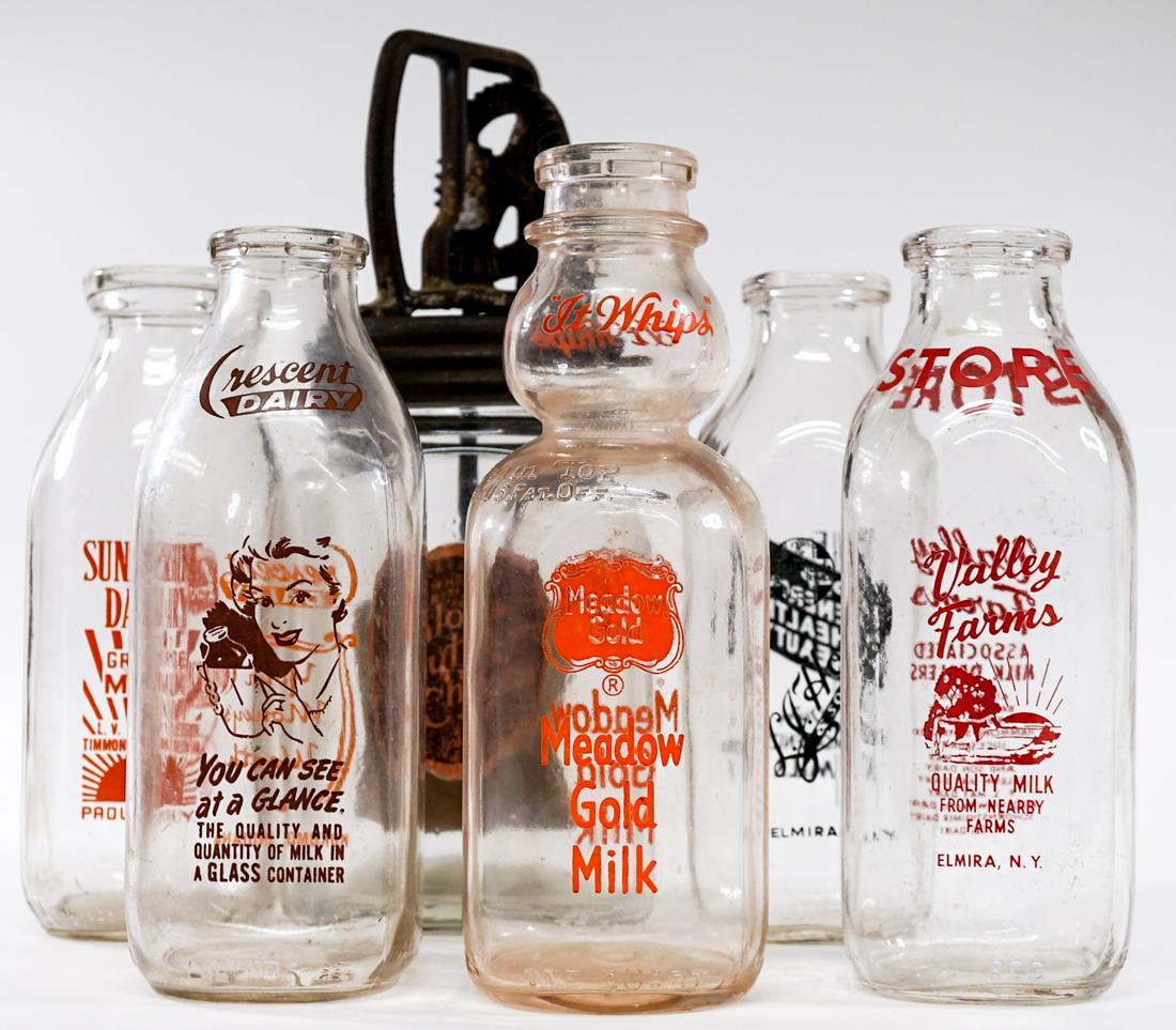 Old Churn & Milk Bottles: Old churn and milk bottles. Lot measures 11in. x 11 in. x 12 in. Weigh approximately 15 lbs. If lot is absent of a condition report one may be requested via email. Condition report is provided as an o