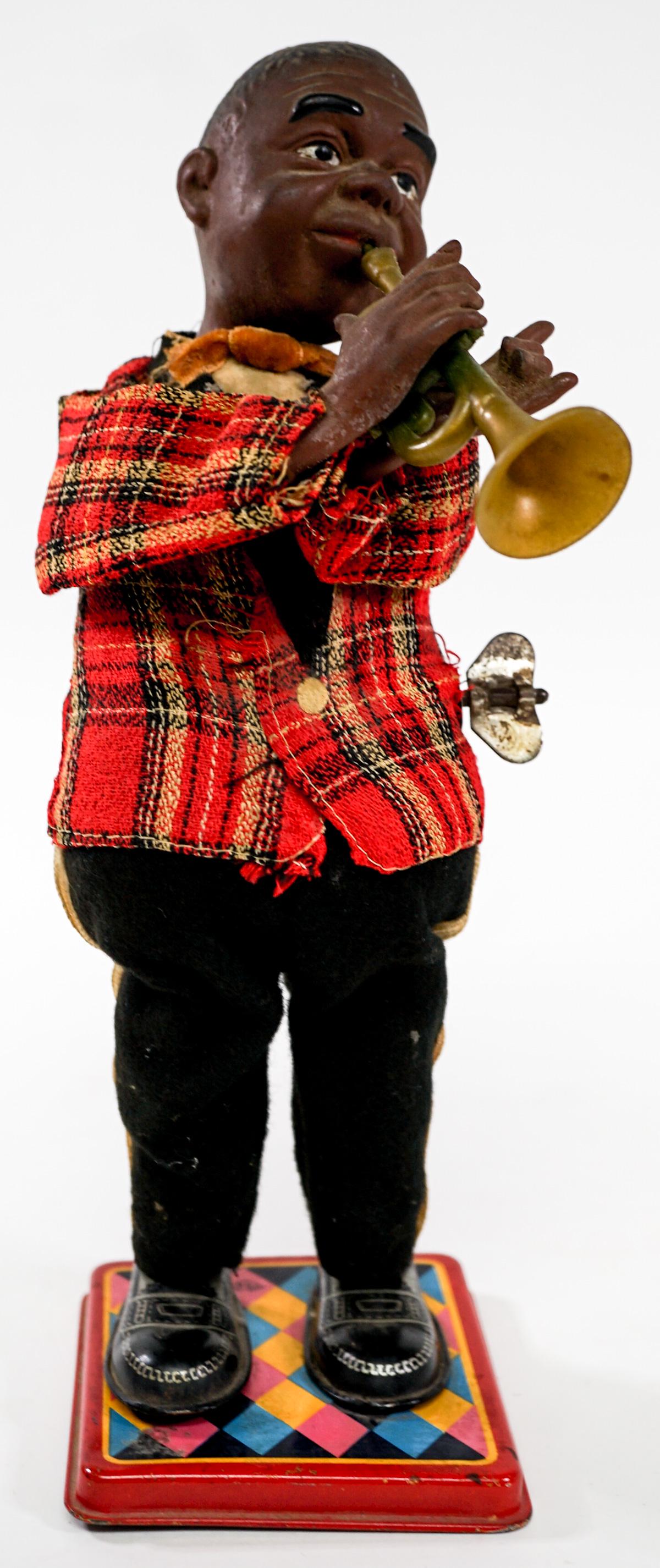 Vintage Wind-Up Toy [Jazz Musician]: Vintage wind-up jazz musician. Tested and works. Measures 9.5 in. tall. Provenance: William Emery Collection, Sheridan Wyoming. If lot is absent of a condition report one may be requested via email. C