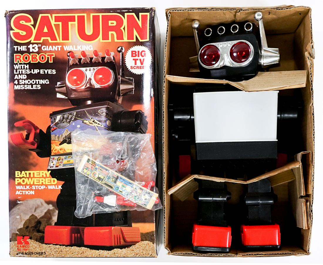 Kamoco Saturn 13" Walking Robot Toy: Vintage Kamoco Saturn 13" Walking Robot with Flashing Eyes. No. 1981. With original box. TESTED WITH 2 D BATTERIES AND WORKS. Includes unused label and 4 missiles. Box measures 12.25 in. x 7.375 in. x