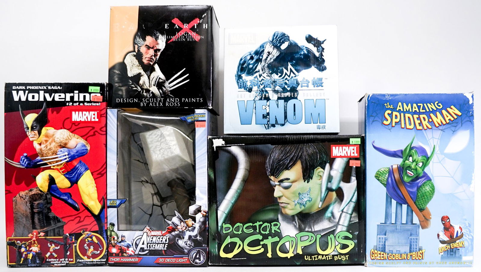 Assortment (6) Marvel Sculptures and Deco Light: Assortment of six (6) Marvel sculptures and more. MIP, some wear to packages. Includes: Wolverine Dark Phoenix Saga; Earth X Logan; Thor Hammer 3D Deco Light (untested); and more. Lot measures 22 in.