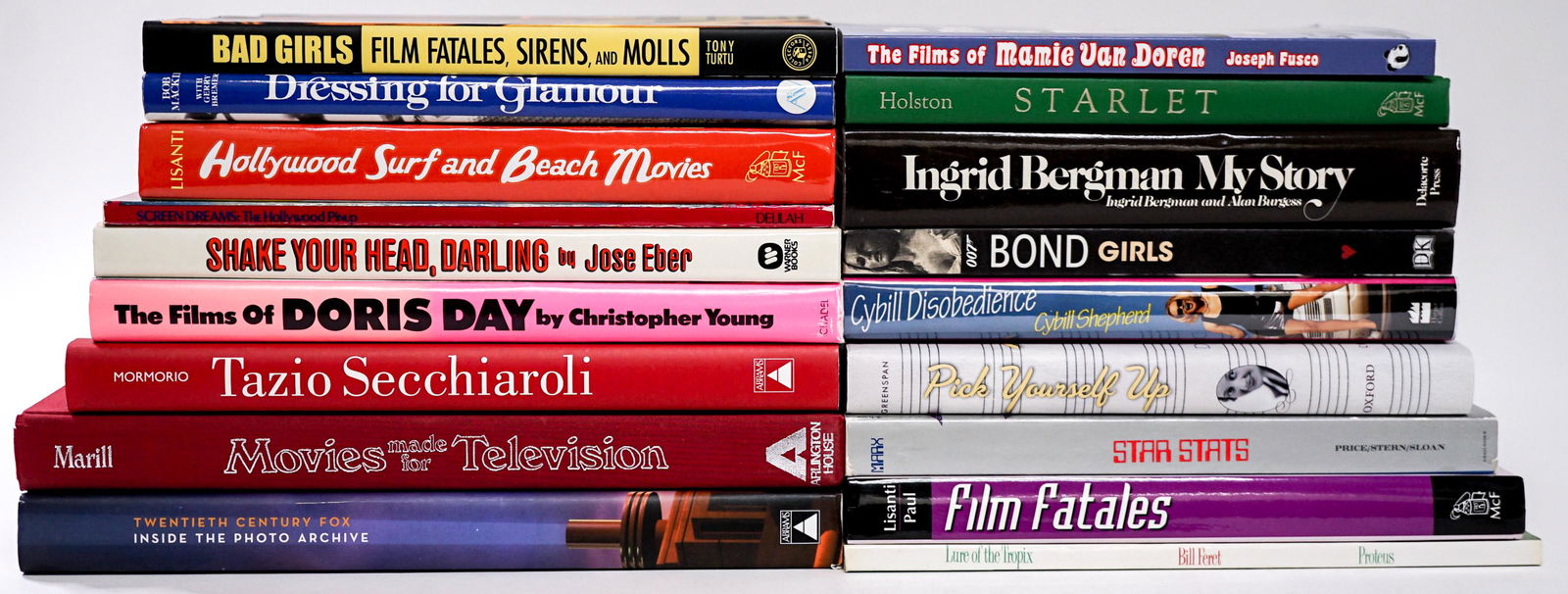 Celebrity (18) Photo Books [Bond Girls]: Eighteen (18) books of celebrities. Includes: Bond Girls; Ingrid Bergman; Doris Day; and more. Lot measures 14 in. x 14 in. x 7 in. Provenance: William Emery Collection, Sheridan Wyoming. If lot is ab