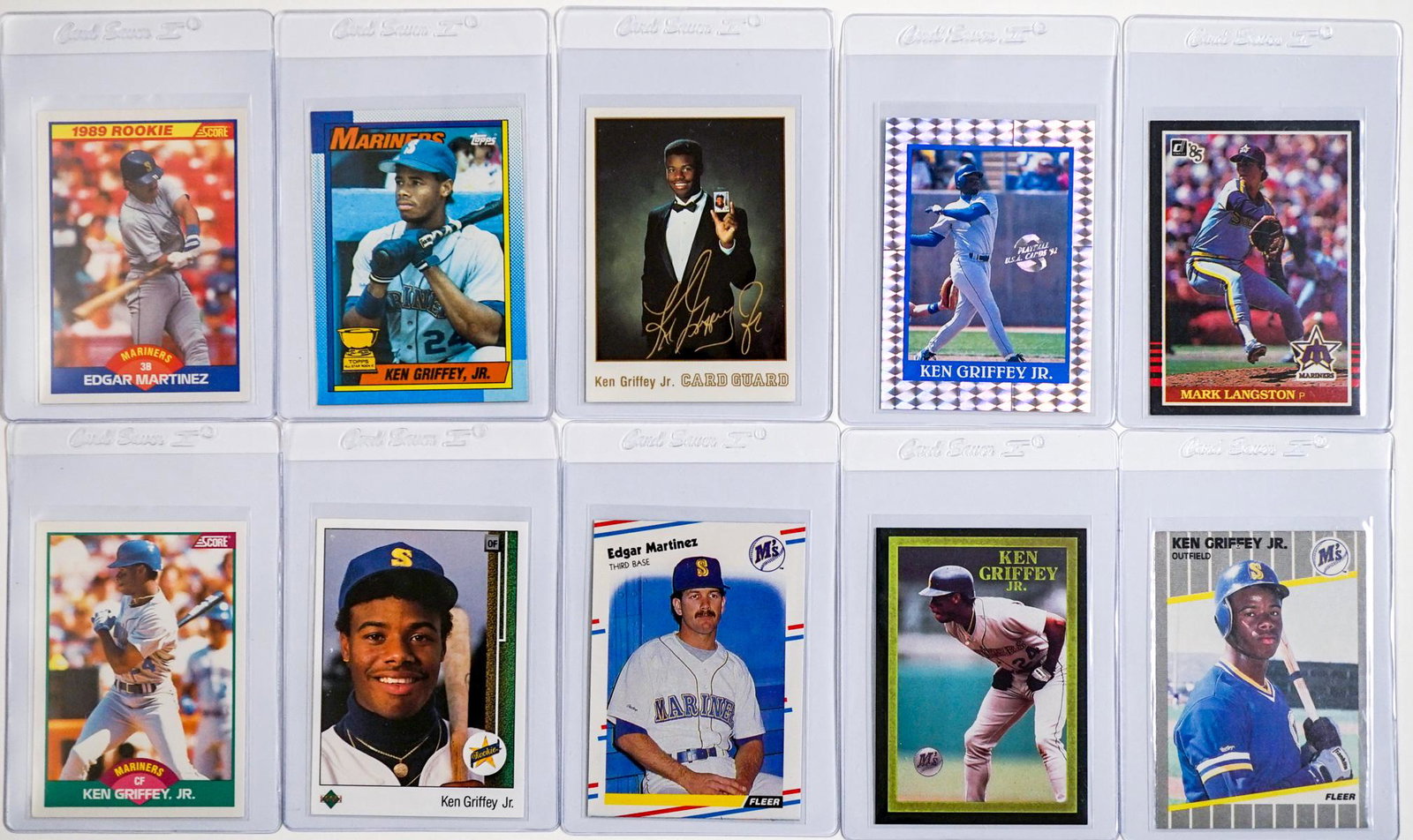 Ken Griffey, Jr., Edgar, Mariners Pack Fresh RC's: Ken Griffey, Jr. rookie cards and promo cards. Edgar and Langston rookie cards. All are pack fresh NM-MT/MT. Ten cards total. This lot requires a Wire or Zelle transfer. If lot is absent of a conditio