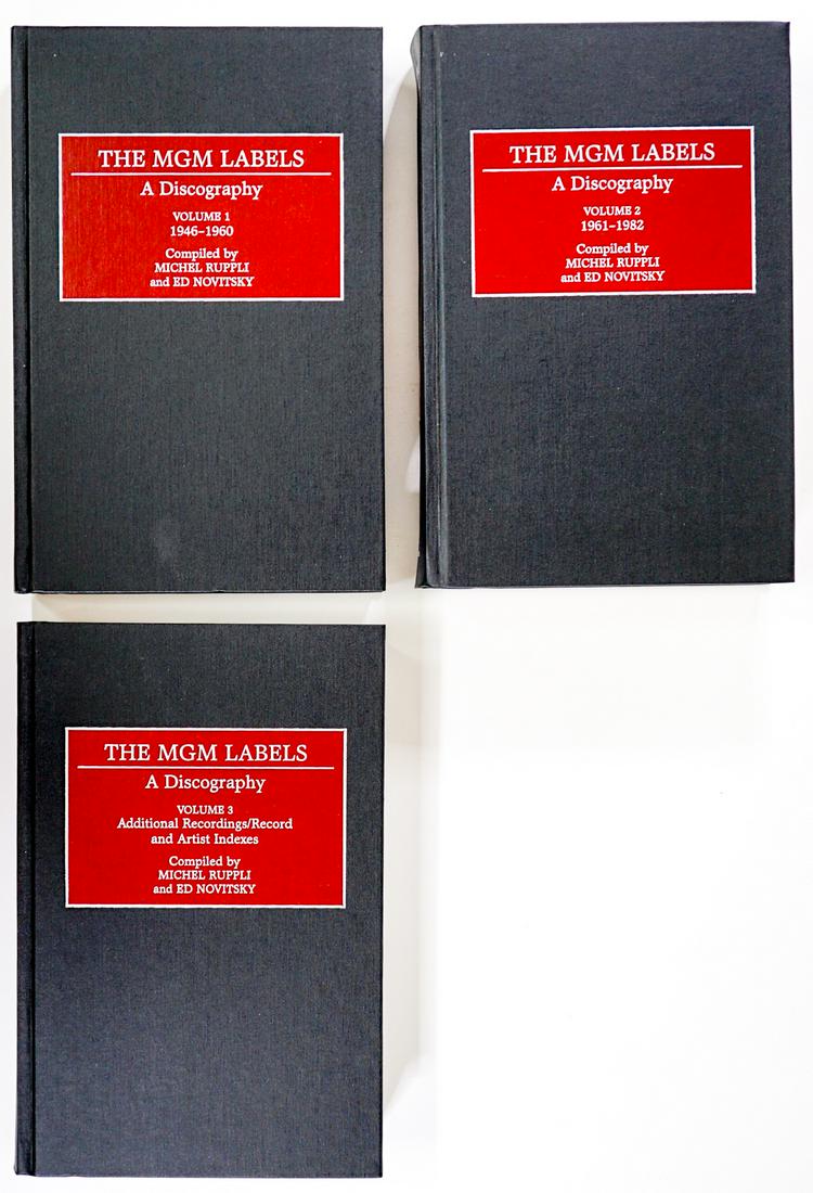 The MGM Labels (3V) Discography [Ruppli]: The MGM Labels 3 Volume Set compiled by Michel Ruppli and Ed Novitsky. 1998 Greenwood Press. Very light wear. Measures 9.5 in. x 6.25 in. x 6 in. Provenance: William Emery Collection, Sheridan Wyoming