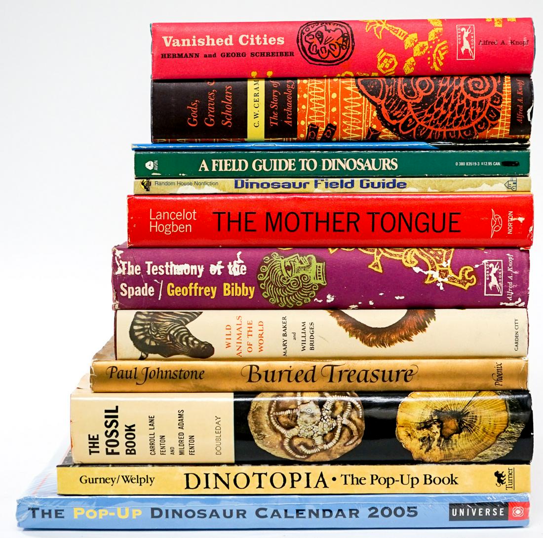 Dinosaurs, Fossils and More (11) Books: Eleven (11) hardcover and softcover books of dinosaurs; fossils, archeology, and more. Includes Dinotopia pop-up book; Wild Animals of the World; and more. Lot measures 12.5 in. x 12.5 in. x 12 in. Pr
