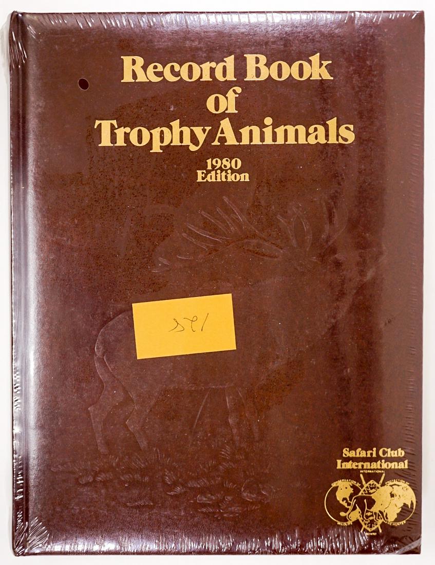 Record Book of Trophy Animals 1980 Edition SEALED: Record Book of Trophy Animals 1980 Edition SEALED. Numbered 128/XXX. If lot is absent of a condition report one may be requested via email. Condition report is provided as an opinion only and is no gu