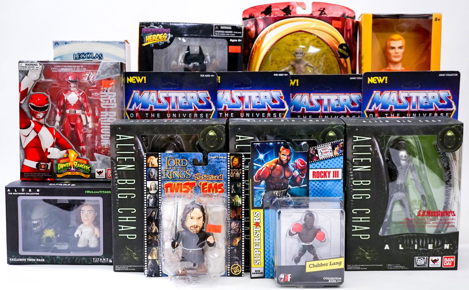 Collectible Figures (15) MIP [Aquaman; He-Man]: Fifteen (15) collectible figures. MIP. Includes: Alien; Lord of the Rings; He-Man; Red Ranger; Batman; and more. Lot measures 16 in. x 12 in. x 16 in. If lot is absent of a condition report one may be