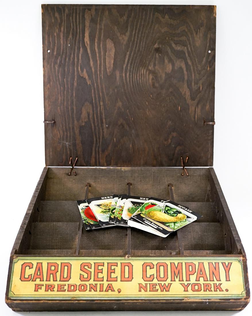 Vintage Card Seed Co. Display Box 1930: Antique 1930's Card Seed Co. Fredonia, N.Y. wood store display box and sixteen (16) seed packets (empty). Box measures 14.75 in. x 16 in. x 4 in. Weighs 5 lbs. If lot is absent of a condition report o