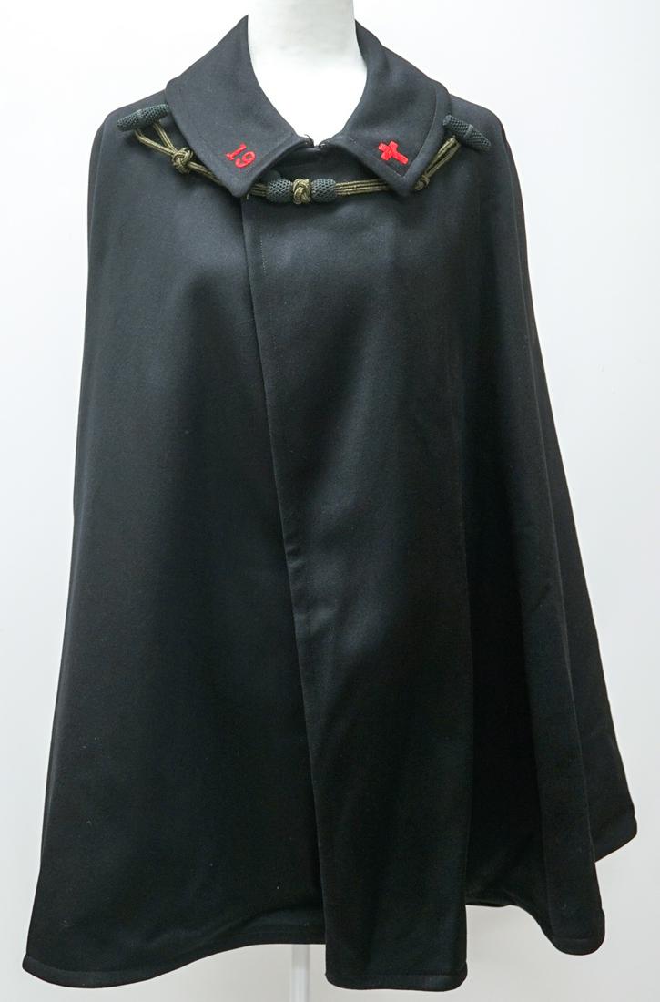 Vintage MC Lilley Wool Cape: Vintage MC Lilley Wool Cape. 'C. D. Munsey' on label. Red Cross inside jacket and left side of collar. The number '19' is on right side of collar. Measures 35 in. from back of collar to hem. The 'Bust