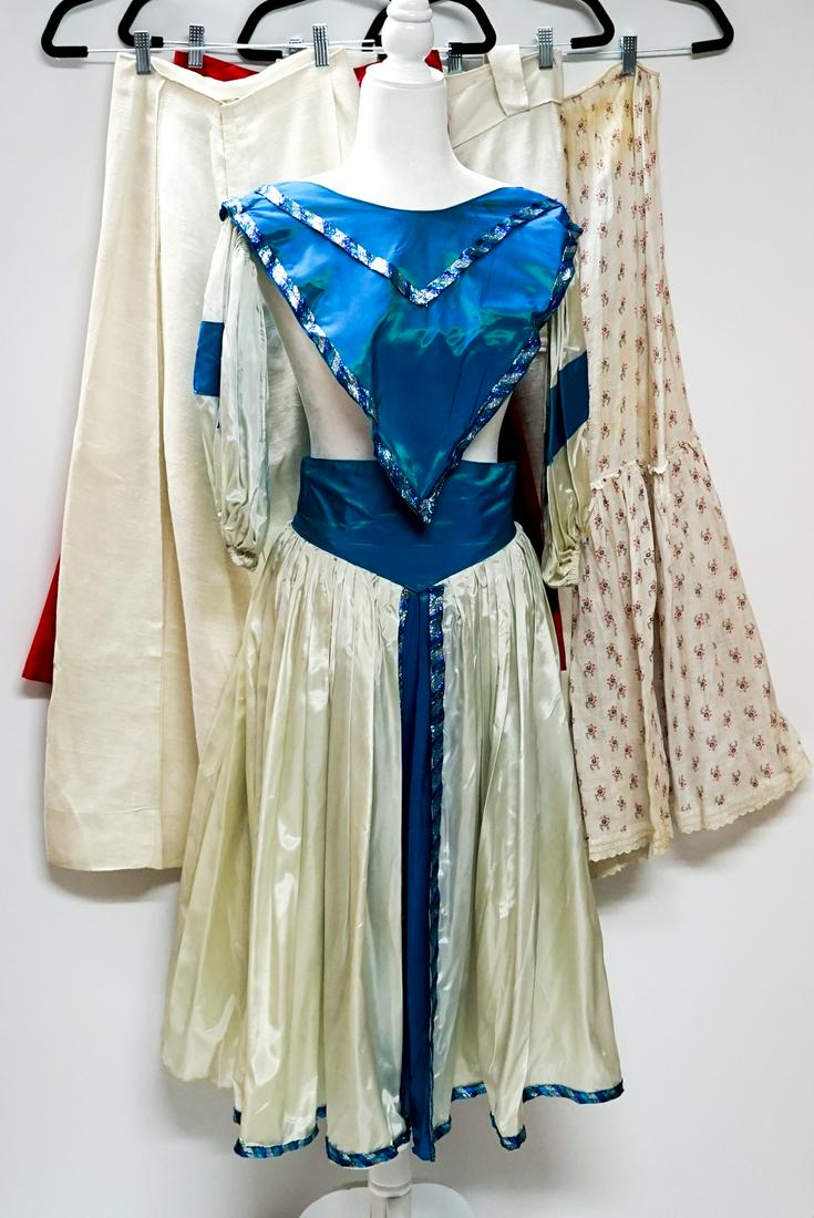 Five (5) Vintage Skirts: Five (5) vintage skirts. Waists measure 23 in. - 28 in. Several stains (see photos). Addtl notes: Group of (4) 1900’s and 1950 walking skirts and (1) mid 20th c. performing costume - fabrics include