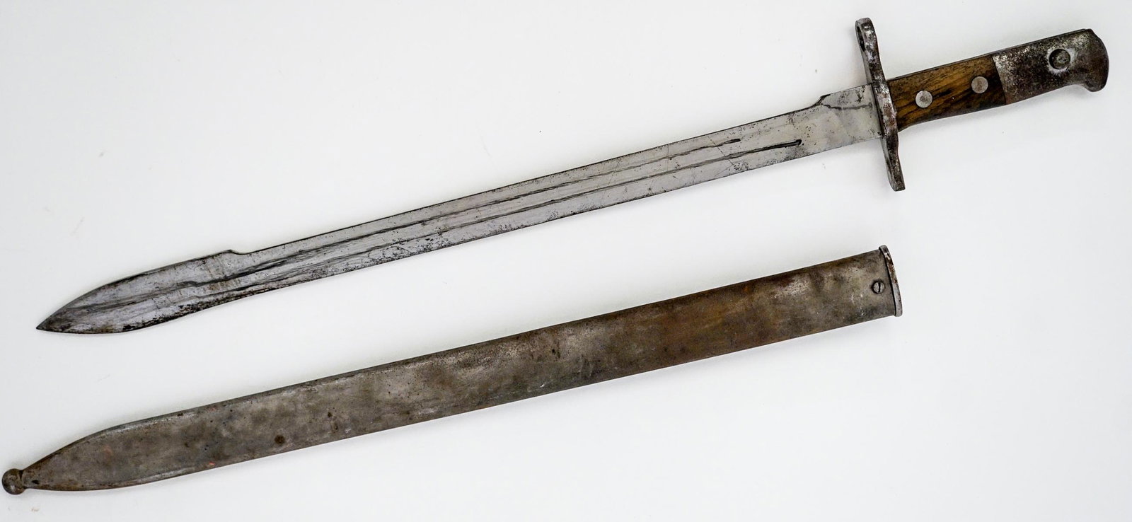 A Swiss WWI Bayonet with Scabbard: Measures 24 inches in length. If lot is absent of a condition report one may be requested via email. Condition report is provided as an opinion only and is no guarantee as grading can be subjective. B