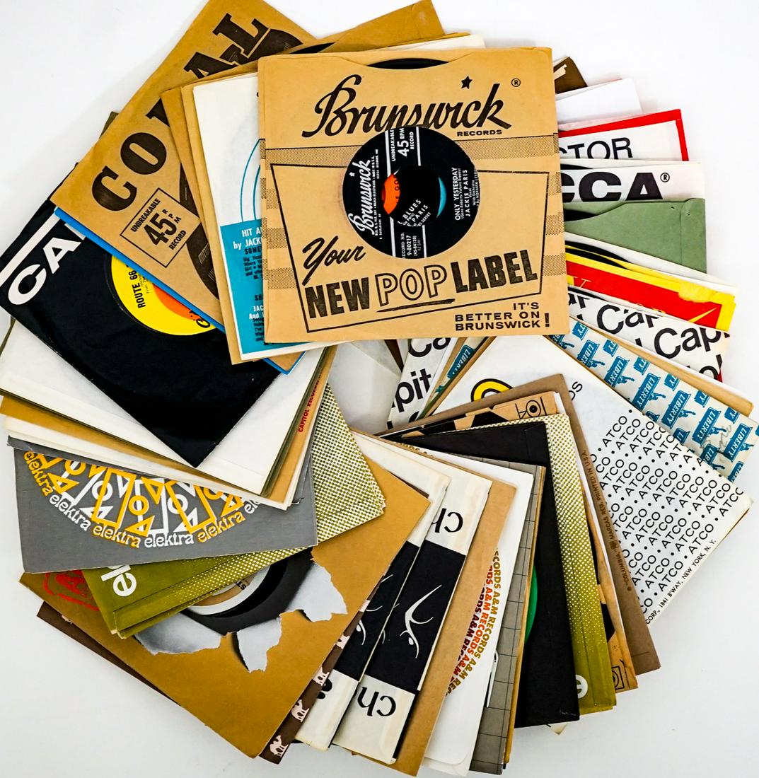 Mixed Genre (50) 7 IN Vinyl 45's: Fifty (50) Vocal and Instrumental 7 inch vinyl records. Includes: The Hi-Lo's; Cher; Bob Dylan; Billy May; Carly Simon; Judy Collins; Natalie Cole; and more. Appear lightly or never played. Provenance