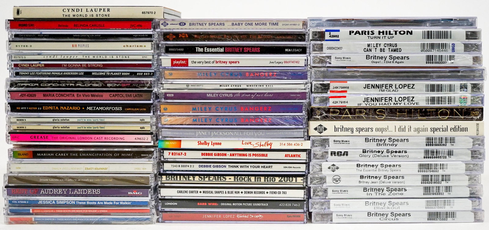 Female (53) CD's [Spears; Lopez; Hilton]: Fifty-three (53) CD's. Includes: Jennifer Lopez; Britney Spears; Paris Hilton; Debbie Gibson; Miley Cyrus and others. Provenance: William Emery Collection, Sheridan Wyoming. If lot is absent of a cond