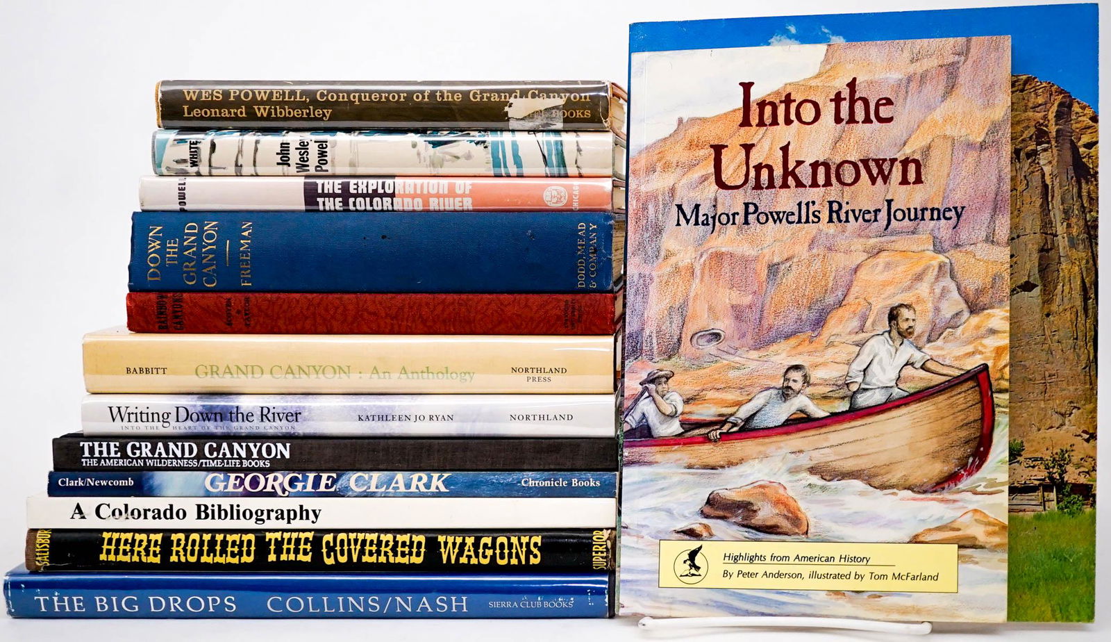 Western Americana (14) Books [Grand Canyon]: Fourteen (14) Western exploration and related hard and softcover books. Includes: 1) Down the Grand Canyon by Freeman. 1924. 2) The Hidden Canyon by John Blaustein and Edward Abbey. 3) John Wesley Pow