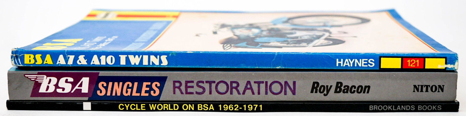 BSA (3) Motorcycle Books: Three (3) softcover books of BSA motorcycles. Includes: BSA Singles Restoration by Roy Bacon 1994; Cycle World on BSA 1962-1971; ...and more. Lot measures 10.75 in. x 8 in. x 1.5 in. Provenance: Bob B