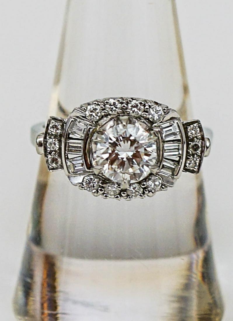 Ladies 18k White Gold Diamond Ring 1 ct VVS1: One Ladies 18k white Gold Dinner Ring, Weighing approximately 3.5 DWT. Set in Center is One Round Brilliant American Cut Diamond, Measuring approximately 6.3 mm diameter x 3.67 mm depth, weighing appr