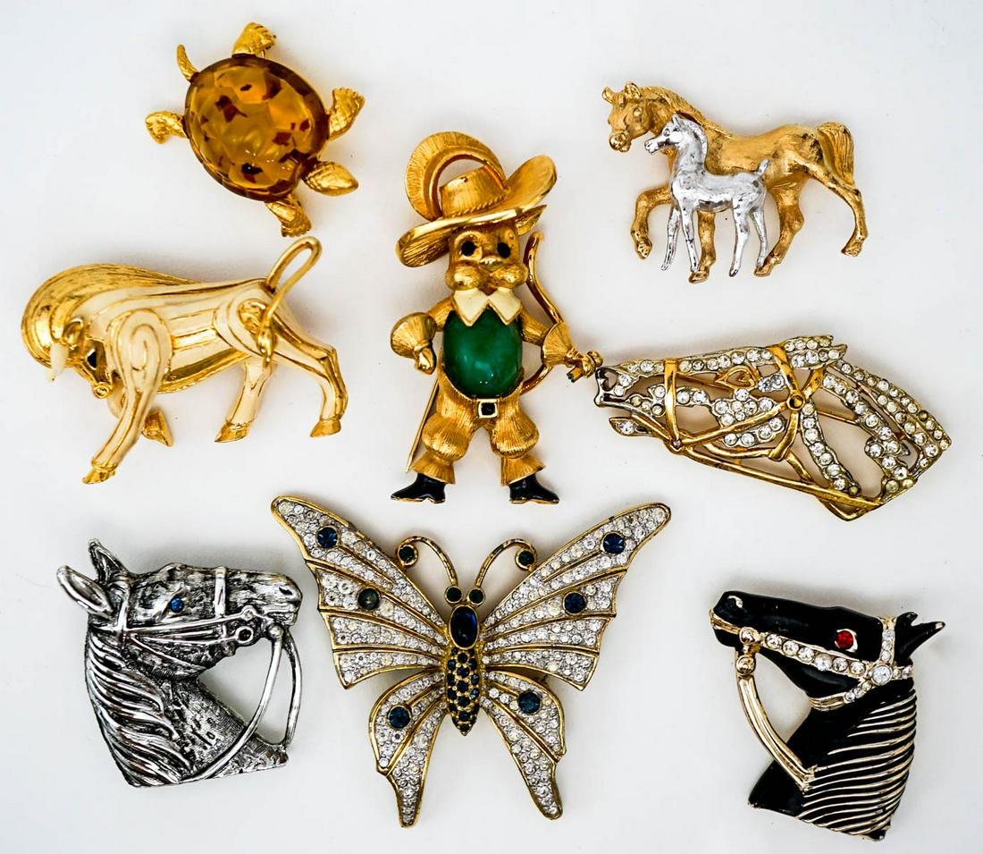 Designer Costume Brooches (8): Designer Costume Brooches (8). Includes Jomaz (Mouse), sterling horse head, Jomaz (butterfly), Napier horses, Dorlan (turtle), Jomaz (bull), and more. The largest measures 2.5 inches x 2 inches, small