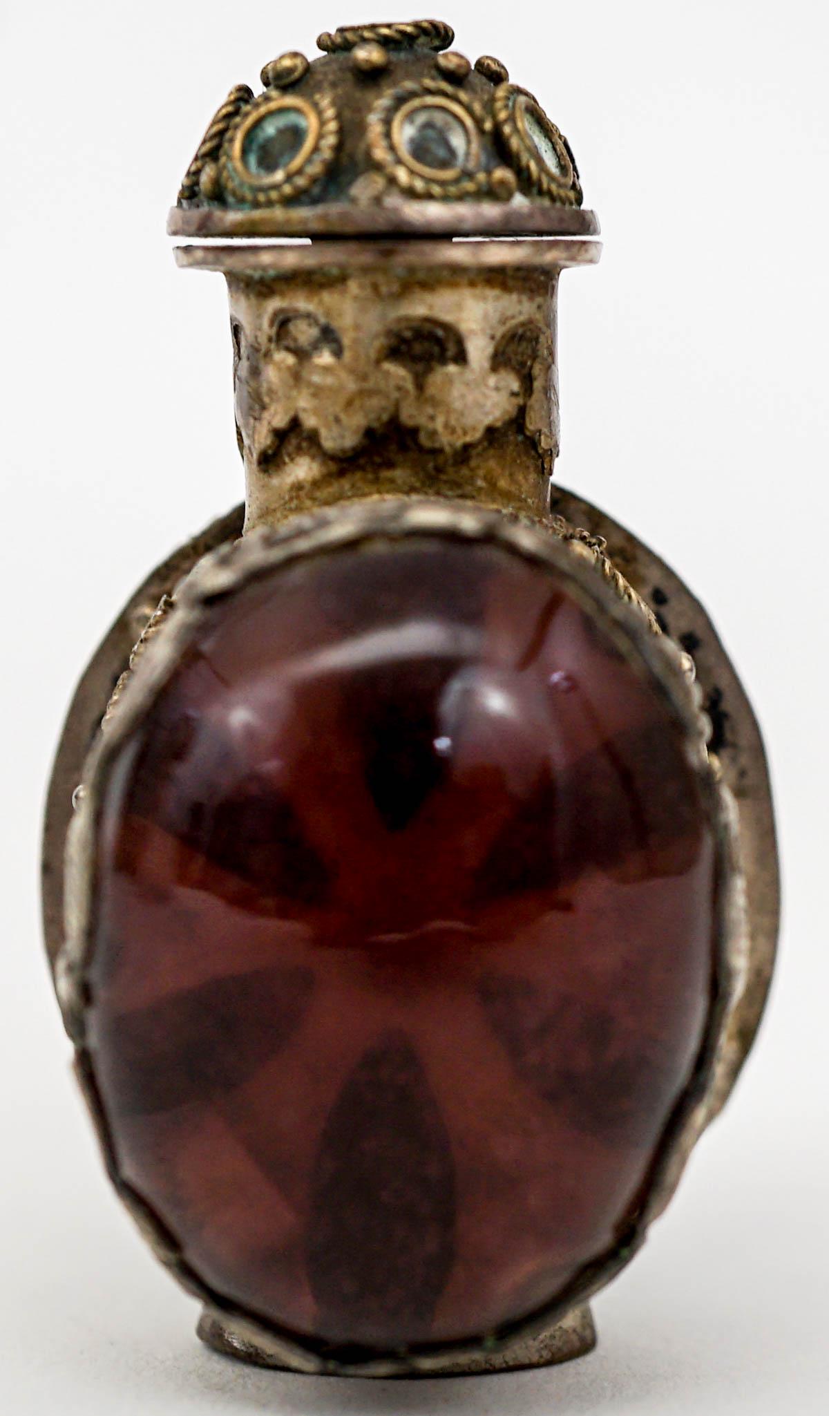 An Antique Snuff Bottle: Measures 2 inches x 1.125 inches. No damage. Provenance: Previously Sabra Carter collection. Collected 1950's-1970's. then by family descent to the Mary Carter collection. Estate of Mary Carter, Spoka