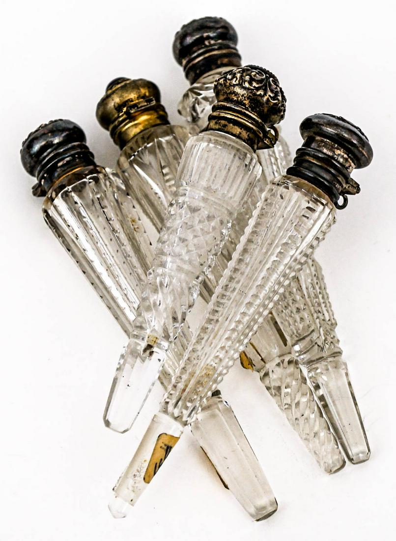 (5) Antique Cut Glass Scent Bottles: (5) Antique Cut Glass Scent Bottles. Hinged-tops, no stoppers. They measure 4.5 to 5 inches. No damage. Provenance: Previously Sabra Carter collection. Collected 1950's-1970's. then by family descent 