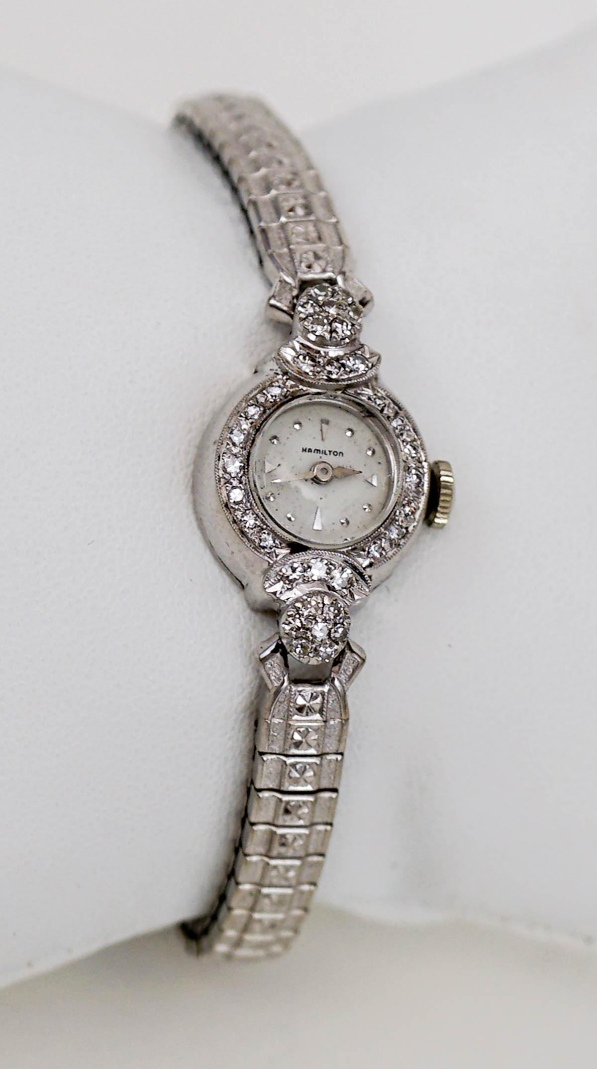 Ladies 14k White Gold & Diamond Hamilton Watch: Ladies 14k White Gold & Diamond Hamilton Watch. 17 jewel watch, case set with 34 single cut diamonds weighing .34 ct total weight, graded SI1 clarity, I-J in color. Payment by wire transfer only. If l