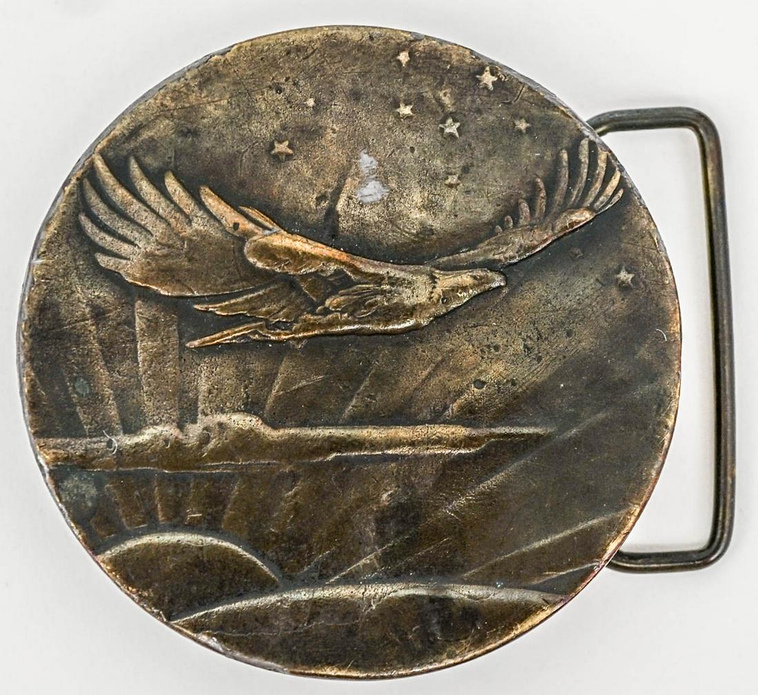 Vintage Bronze Belt Hook Buckle [Eagle]: Vintage bronze belt hook buckle of a soaring eagle and sunrise scene. Measures 2.625 in. across face. If lot is absent of a condition report one may be requested via email. Condition report is provide