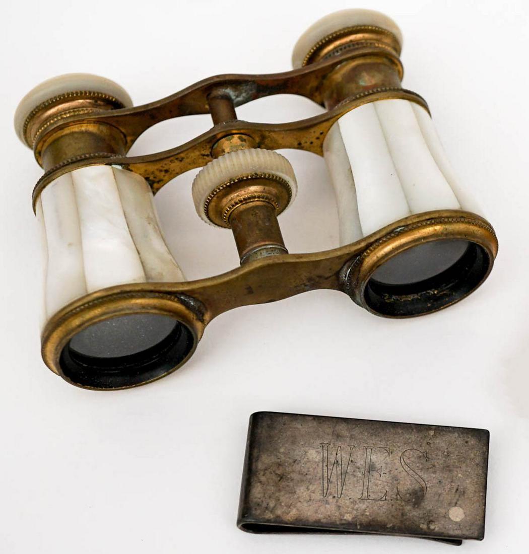 Mother of Pearl Opera Glasses: Mother of Pearl opera glasses and a sterling money clip. No damage. If lot is absent of a condition report one may be requested via email. Condition report is provided as an opinion only and is no gua