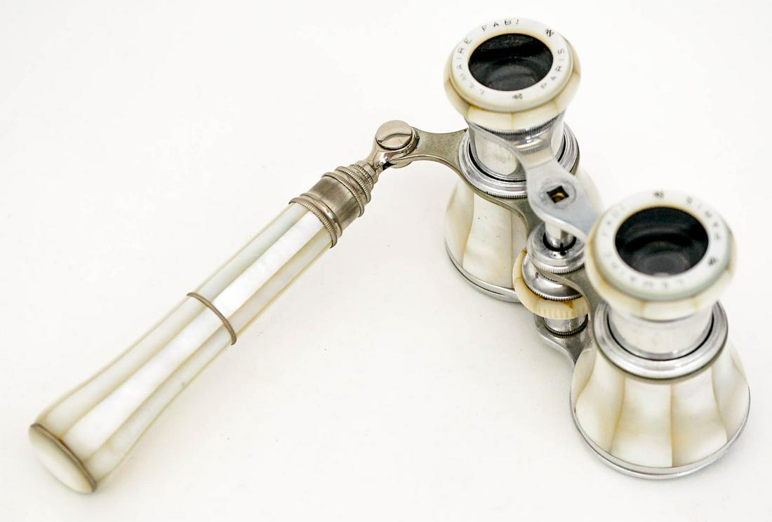 A Pair of MOP Antique Opera Glasses: They measure 4-in. x 2.5-in. x 3-in. Very good to excellent condition. If lot is absent of a condition report one may be requested via email. Condition report is provided as an opinion only and is no