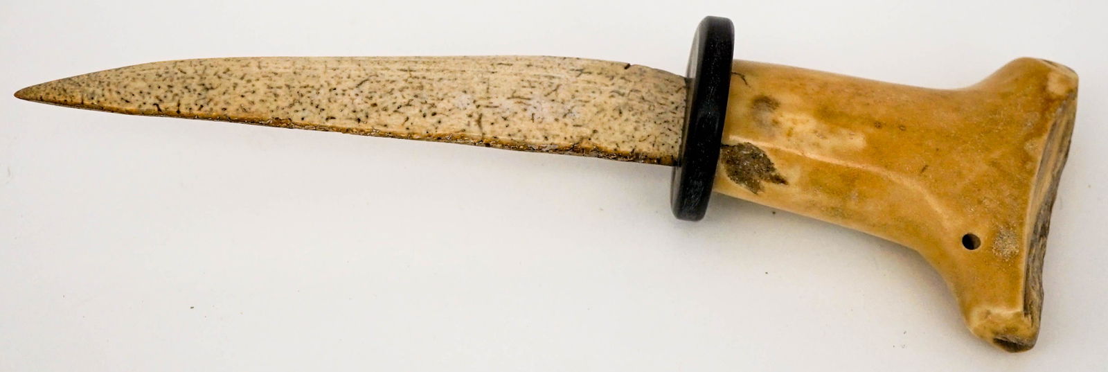 Pacific Northcoast Carved Dagger: Pacific Northcoast carved dagger. Measures 8.5 in. long. If lot is absent of a condition report one may be requested via email. Condition report is provided as an opinion only and is no guarantee as g