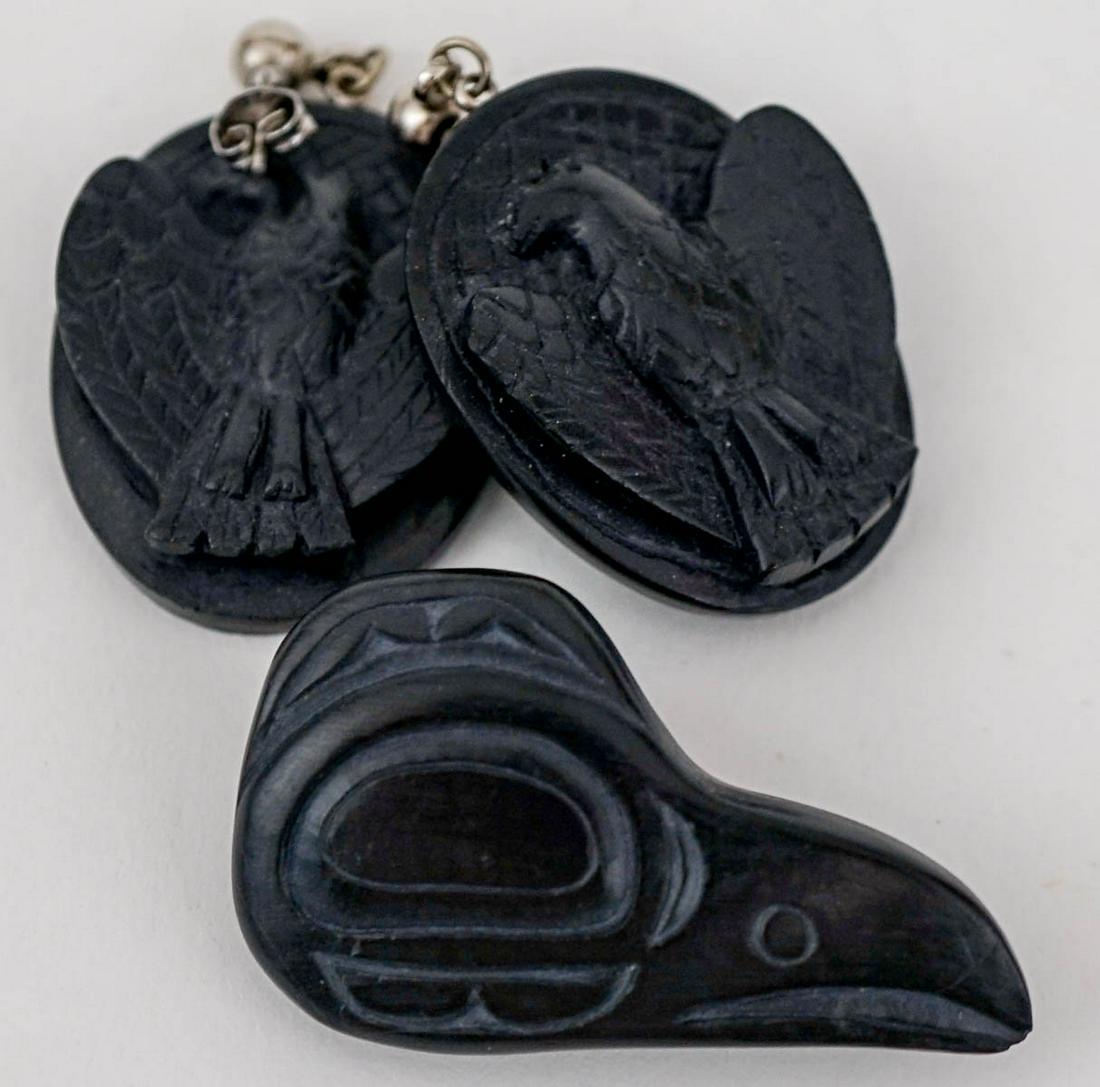 Argillite Pair of Earrings and Brooch [Eagle]: Pacific Northcoast argillite pierced earrings (unsigned) and brooch (signed Miles Chardson). Earrings measure 1.25 in. x 1.0 in. and the brooch measures 1.625 in. x 1 in. If lot is absent of a conditi