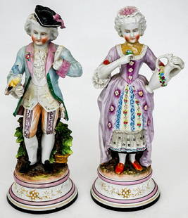 19th C (2) Fine China Figurines [Victorian Dress]: Pair of 19th Century Victorian Dress fine china figurines. Hand painted. Measure 13.125 in. - 13.5 in. tall x 4.825 across bases. Weighs 6 lbs. If lot is absent of a condition report one may be reques