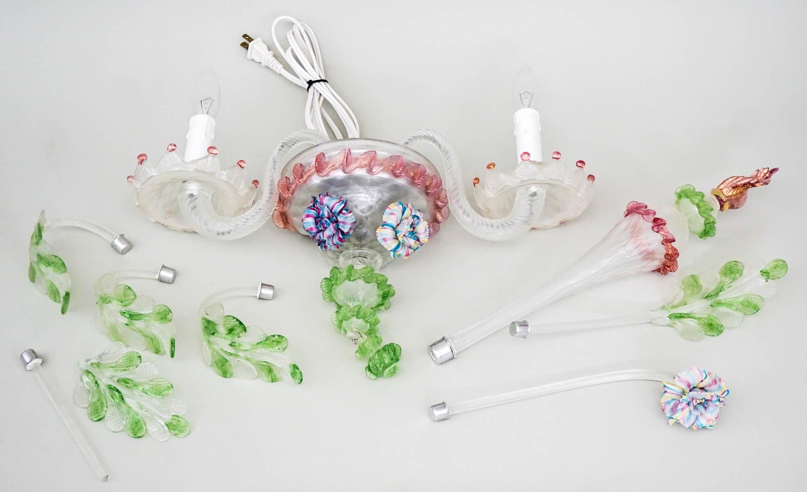 Vintage Electric Wall Sconce [Murano Glass]: Italian Murano glass vintage electric wall sconce. Note one arm broken at stem (see photo). Frosted glass with botanical and floral design. Measures 25 in. tall by 18.5 in wide x 6.5 in. deep. Weighs 