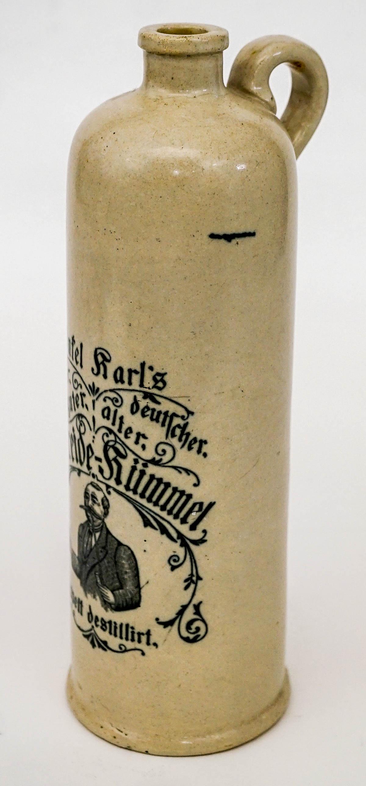 Vintage German Wine / Beer Crock Bottle / Stein: Vintage glazed German stoneware crock bottle / stein with handle. Measures 11 in. tall x 4.25 in. wide measured with handle and 3.75 in. across base. If lot is absent of a condition report one may be 