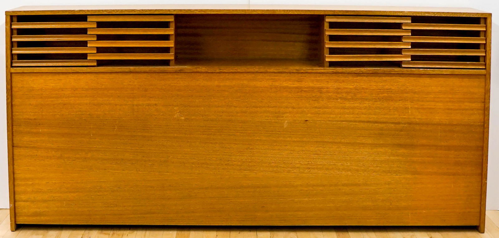 Mid-Century Headboard by Paul Laszlo: A very nice and iconic headboard by Paul Laszlo for Brown-Saltman. Measures Height: 39 in. Width: 82 in. Depth: 11 in. This wood has some light scratches, scuffs and wear. Overall good condition. This