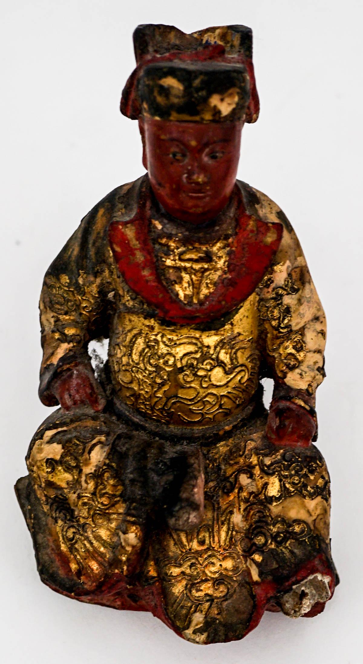 Chinese Wood Model of an Official: Chinese Antique Carved Wood Figure. Chinese wood model of an official with gilded robe, 19th century [Temple Figure]. Measures 5.375 inches x 3 inches. If lot is absent of a condition report one may b