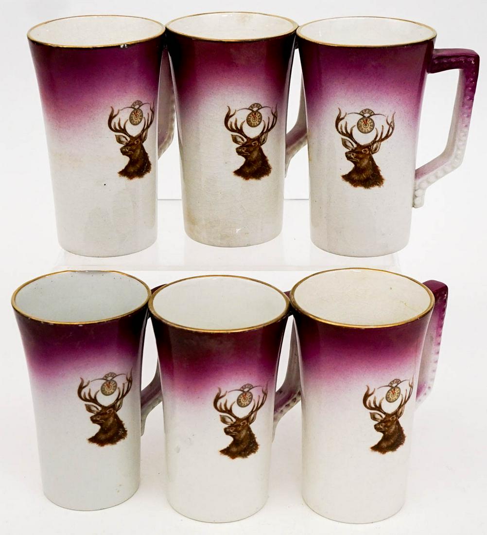 BPOE Elks Lodge (6) Mugs [Usona Goodwin]: Six (6) Elks Lodge BPOE mugs. Note one is cracked, see photo. Gilt and color is worn in spots. Measure 4.5 in. tall x 2.75 in. across rim x 3.75 in. wide. Weigh 3 lbs. 'BPOE' The Benevolent and Protec