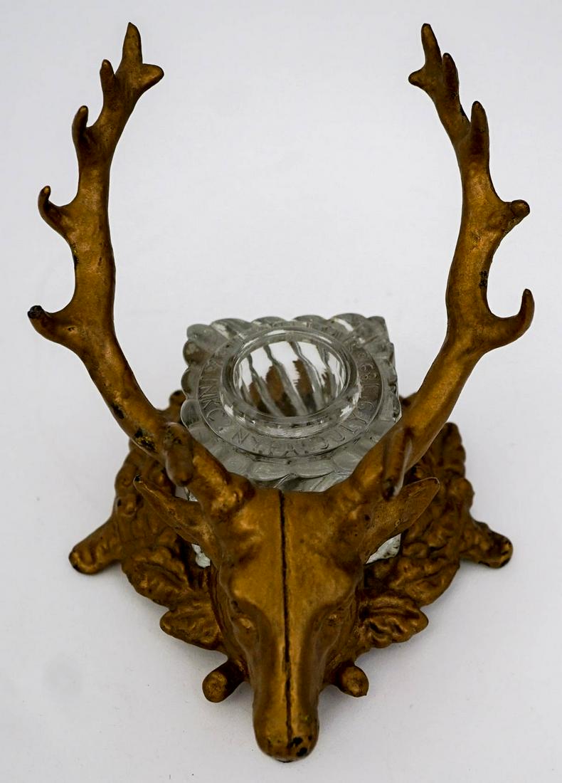 Vintage Elk Inkwell and Pen Holder: Vintage cast iron and crystal Elk Inkwell and Pen Holder. No makers mark found. Measures 7 in. x 5.5 in. x 5.5 in tall. The crystal inkwell measures 2.5 in. square. Note small chip on edge of crystal