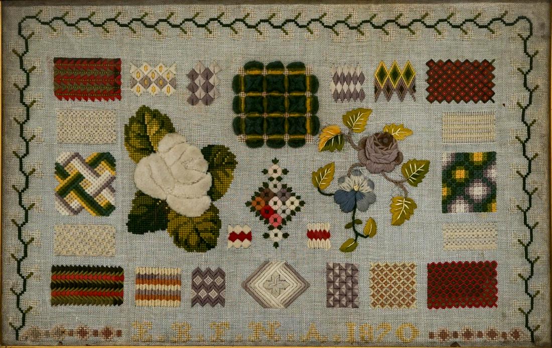 A 1870 Floral Sampler: A 1870 Floral Sampler. Measures 13.5-in. x 20-in. framed. Mounted and in original frame. If lot is absent of a condition report one may be requested via email. Condition report is provided as an opini