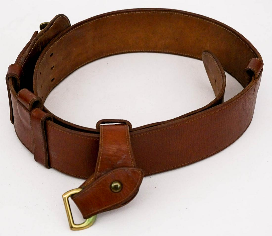 Military Brown Leather Belt with Fob SZ 35: Military brown leather belt with fob. Marked size 35. Scuffed along back. If lot is absent of a condition report one may be requested via email. Condition report is provided as an opinion only and is 