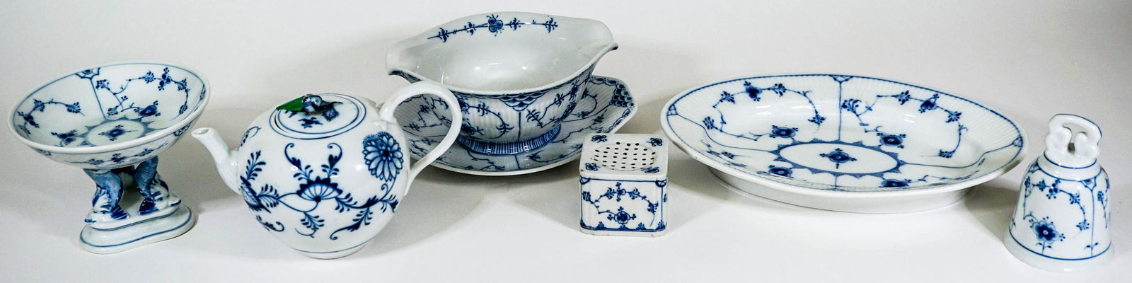 Denmark Blue Porcelain (7) Serveware: Seven (7) blue porcelain serveware pieces with various or no markings. Note the gravy is attached to the plate and counts as one (1) piece. Weigh approximately 15 lbs. Provenance: Estate of David Milo