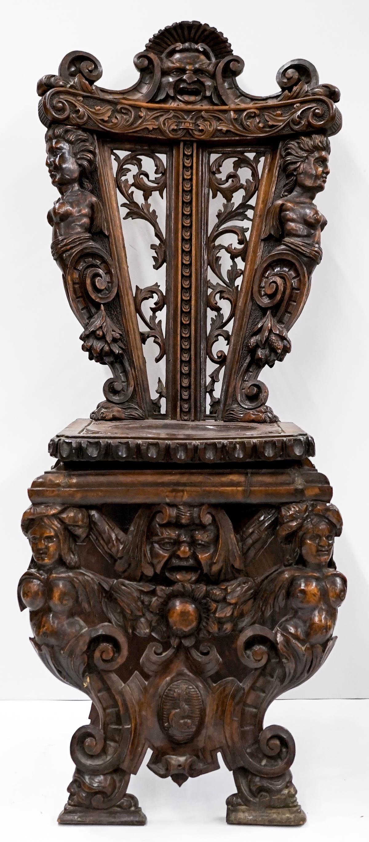 An Antique Carved Wood Chair: An Antique Carved Wood Chair. Measures 45 inches x 19.5 inches x 18 inches. If lot is absent of a condition report one may be requested via email. Condition report is provided as an opinion only and i